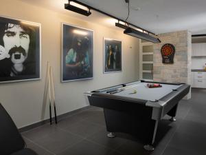Herňa v ubytovaní Villa Vlastelini II by Interhome