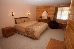 Кровать или кровати в номере Glenogle Mountain Lodge and Spa