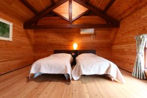 Tempat tidur dalam kamar di Tubakiann