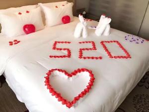 Ліжко або ліжка в номері Lavande Hotel Shanghai Jiading Xincheng Stadium Branch