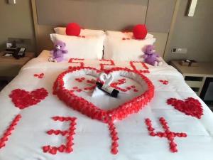Ліжко або ліжка в номері Lavande Hotel Shanghai Jiading Xincheng Stadium Branch