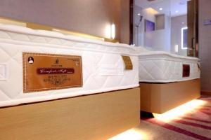 Ліжко або ліжка в номері Lavande Hotel Shanghai Jiading Xincheng Stadium Branch