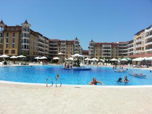 a group of people in a large swimming pool at Menada Royal Sun Apartments in Sunny Beach