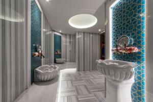 a bathroom with two sinks and two toilets at The Hotel Beyaz Saray - Grand Bazaar in Istanbul