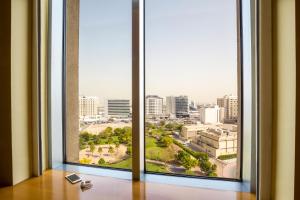 an open window with a view of a city at ibis Deira Creekside Dubai in Dubai