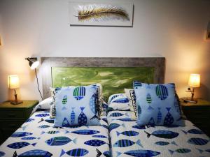 Apartamento amplio Canary Style, 1 Playa Canteras tesisinde bir odada yatak veya yataklar