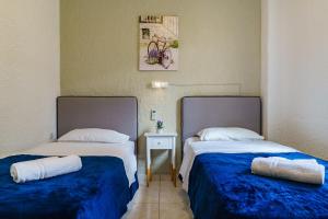 Postel nebo postele na pokoji v ubytování Argyro Rent Rooms