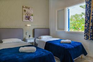 Postel nebo postele na pokoji v ubytování Argyro Rent Rooms