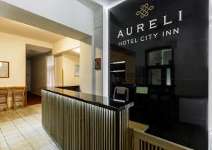 a view of a hotel lobby with a black counter at City-Inn in Prague