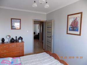 Posteľ alebo postele v izbe v ubytovaní APARTAMENT CENTRUM MIASTA