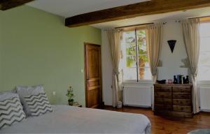 Postel nebo postele na pokoji v ubytování Maison Olleris