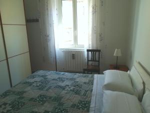 Un pat sau paturi într-o cameră la La Terrazza