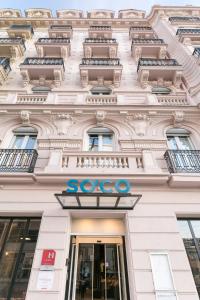 a facade of a building with a soo sign on it at Hotel So’Co by Happyculture in Nice
