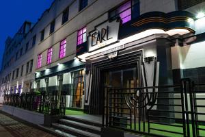 a facade of a building with colorful lights at Earl Of Doncaster Hotel in Doncaster