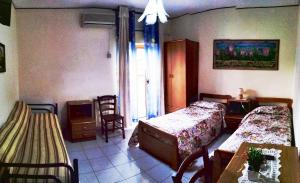 Postel nebo postele na pokoji v ubytování Hotel Eliseo