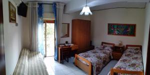 Postel nebo postele na pokoji v ubytování Hotel Eliseo