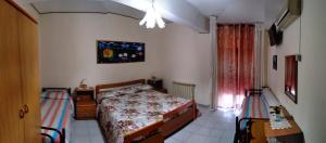Postel nebo postele na pokoji v ubytování Hotel Eliseo