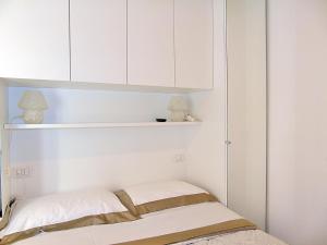 A bed or beds in a room at The Best View Of The Sea