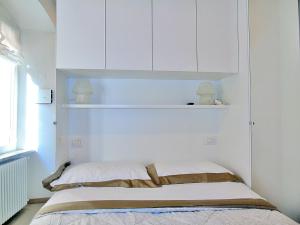A bed or beds in a room at The Best View Of The Sea