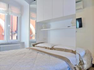 A bed or beds in a room at The Best View Of The Sea
