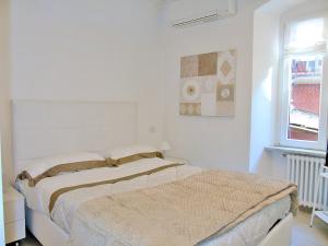 A bed or beds in a room at The Best View Of The Sea