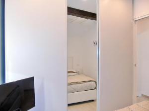 A bed or beds in a room at The Best View Of The Sea
