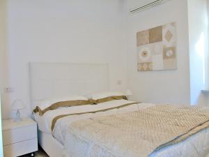 A bed or beds in a room at The Best View Of The Sea