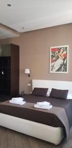 Posteľ alebo postele v izbe v ubytovaní Mia Suites