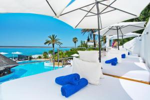 a villa with a view of the pool and the ocean at El Oceano Beach Hotel Adults only recommended in La Cala de Mijas