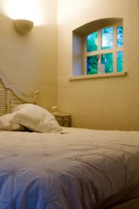 Postel nebo postele na pokoji v ubytování Guesthouse Veerhoeve