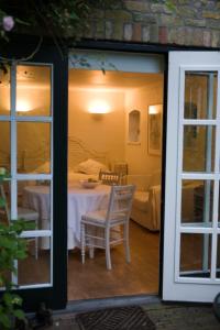 Postel nebo postele na pokoji v ubytování Guesthouse Veerhoeve