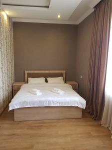 Giường trong phòng chung tại White House in Kakheti Eniseli