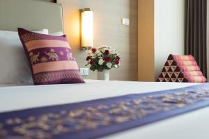 Postel nebo postele na pokoji v ubytování Marsi Hotel Bangkok