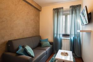 a living room with a couch and a table at Apartment Auretta in Novigrad Istria