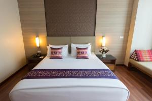 Postel nebo postele na pokoji v ubytování Marsi Hotel Bangkok