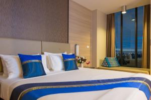 Postel nebo postele na pokoji v ubytování Marsi Hotel Bangkok + 37 fotografií