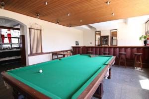 a pool table in a room with a pool table at Samba Betim in Betim