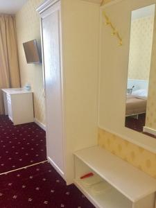 Postel nebo postele na pokoji v ubytování Sergeev Hotel