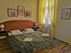 מיטה או מיטות בחדר ב-Auspicie Apartment