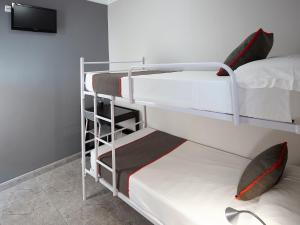 Postel nebo postele na pokoji v ubytování Hostal Mas Ferrer