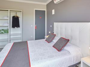 Postel nebo postele na pokoji v ubytování Hostal Mas Ferrer