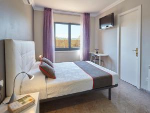 Postel nebo postele na pokoji v ubytování Hostal Mas Ferrer