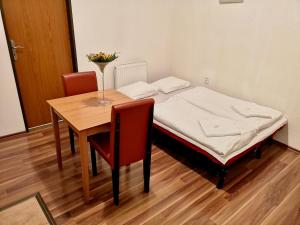 Postel nebo postele na pokoji v ubytování Auspicie Apartment