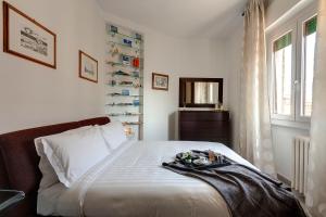 Säng eller sängar i ett rum på Mamo Florence - Binario9 Terrace Apartment