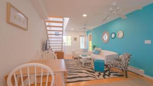 a living room with a couch and a table at The Ocean Dunes at Amagansett in Amagansett