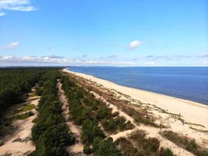 an aerial view of a beach next to the ocean at Ośrodek Wczasowy Bursztyn in Gdańsk