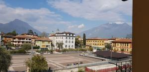 a view of a city with mountains in the background at Terme Romane in Riva del Garda