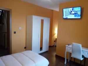 TV a/nebo společenská místnost v ubytování A Casa do Ferrador