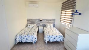 Posteľ alebo postele v izbe v ubytovaní MARILU SEAVIEW & BEACH - apartment