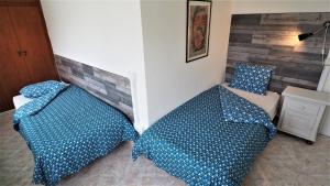 Posteľ alebo postele v izbe v ubytovaní MARILU SEAVIEW & BEACH - apartment
